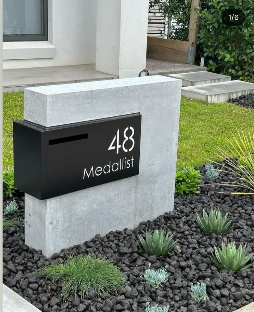 Custom LED stainless steel brick-in mailbox installed on modern Australian home exterior rendered wall
