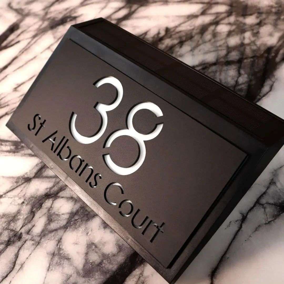 Modern black solar-powered acrylic house sign with illuminated number 38 and St Albans Court address engraving